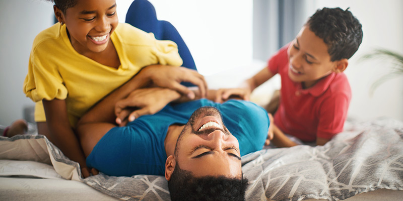 Family Enjoying Hvac Repair On Bed